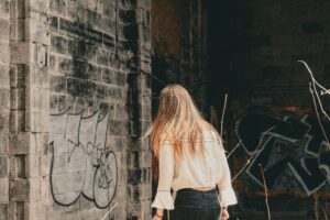 Weathered stone building with a dark moody atmosphere and shadows