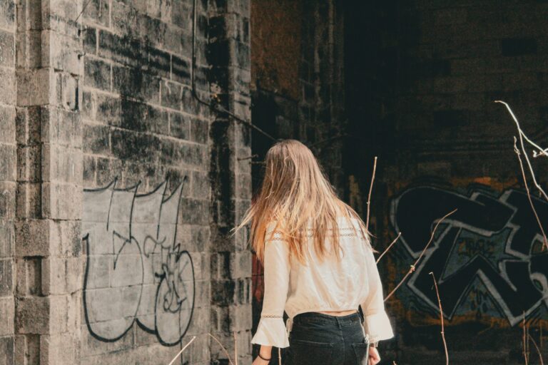 Weathered stone building with a dark moody atmosphere and shadows