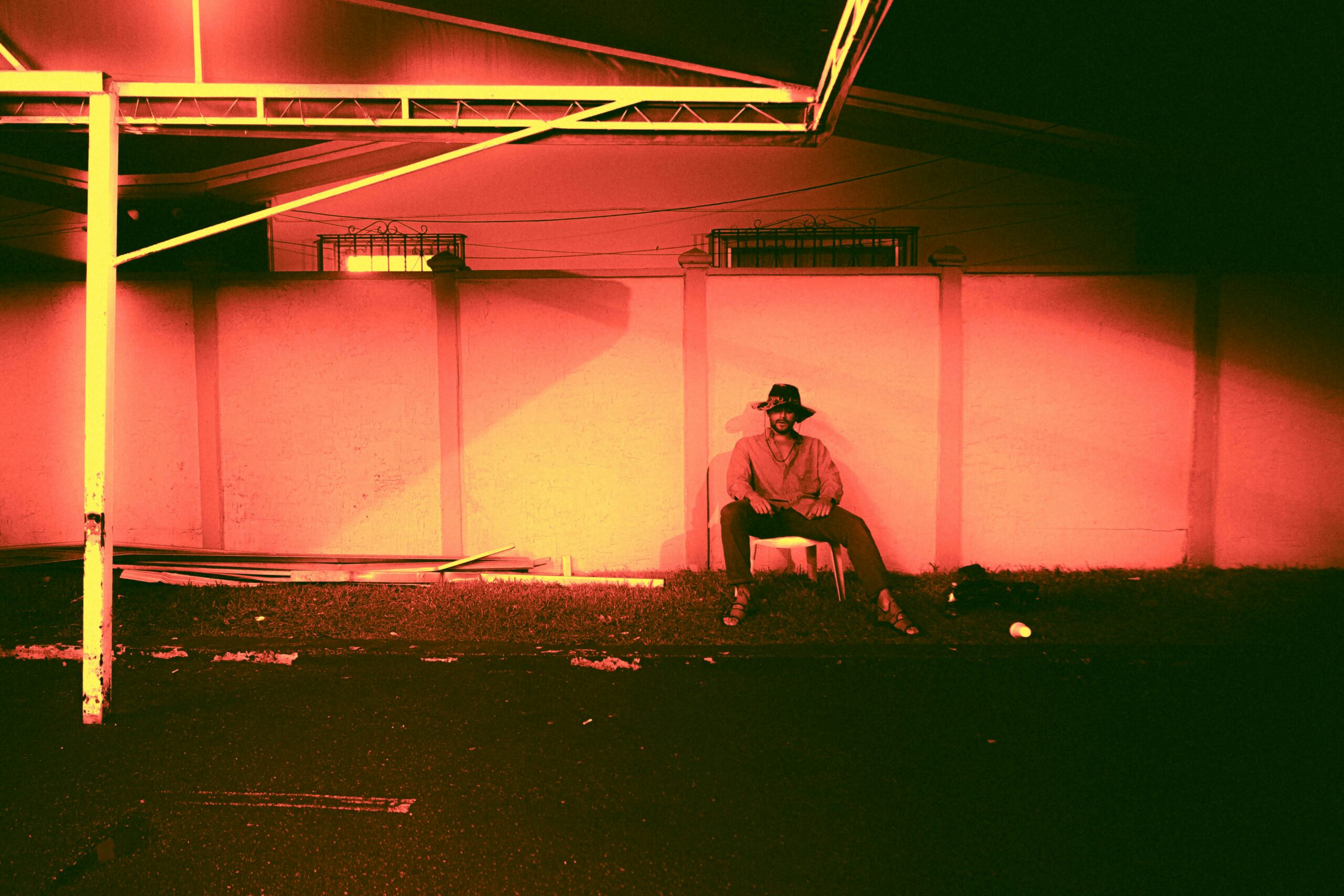 Vivid red and orange sunset light filling a room through large windows