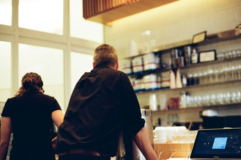 Couple walking through a grand building entrance, illustrating the hidden dating theories shaping Christian relationships