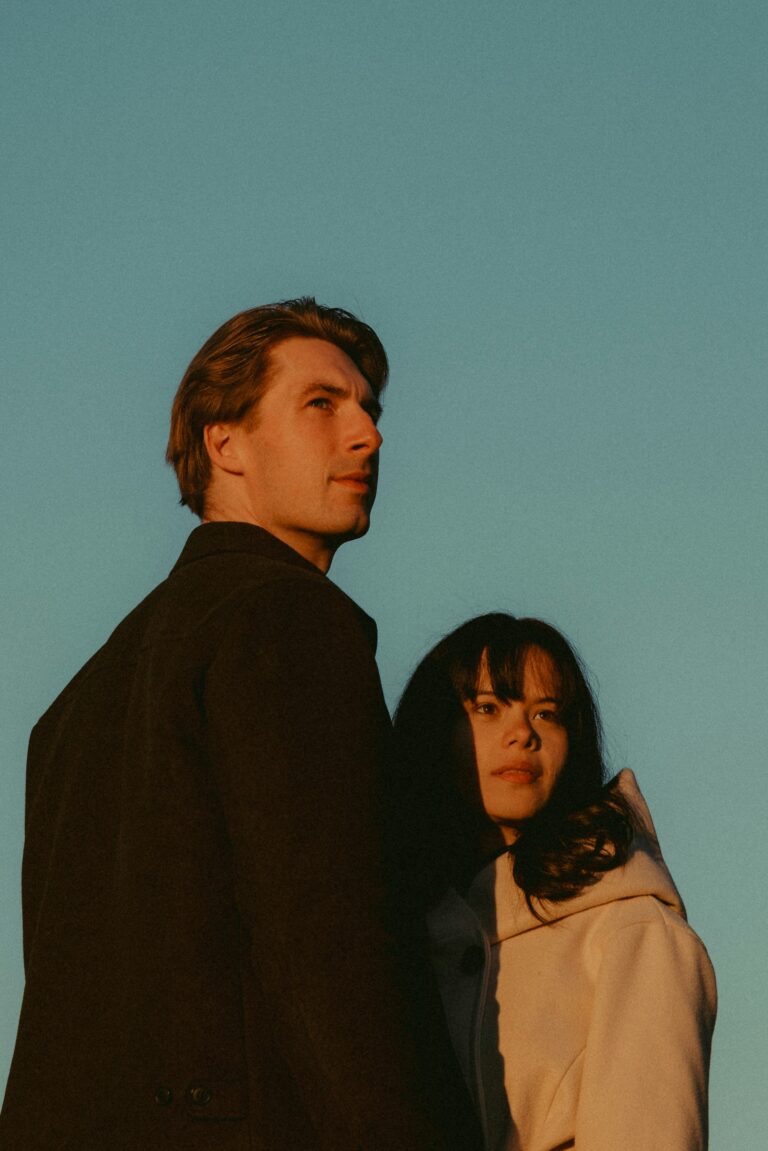 Man and woman looking up at the evening sky together, Let's Talk About It podcast episode on how to pursue and be pursued