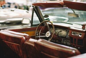 Let's Talk About It Podcast - The Truth About Christian Dating: interior of a vintage convertible with brown leather seats